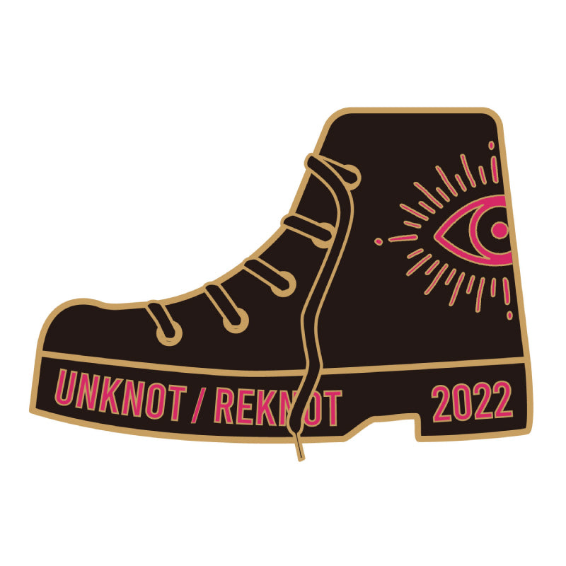 "UNKNOT / REKNOT" pin badge